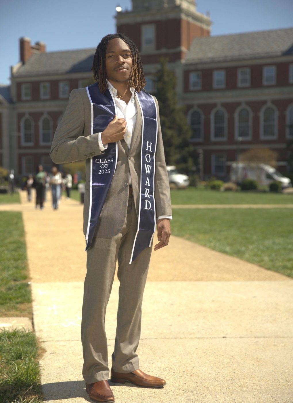 Coach Trey graduating with his degree from Howard